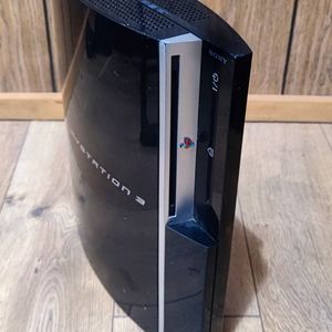 PlayStation 3 with 4 games & controller